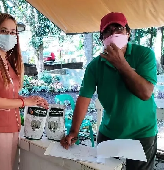 Rosario personnel documenting agricultural support for a farmer